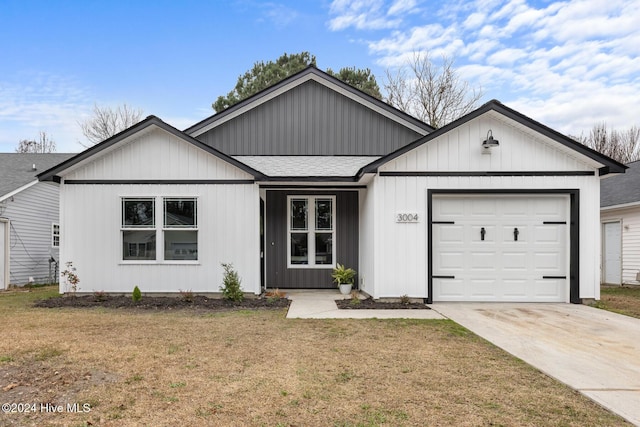 single story home featuring a front yard and a garage