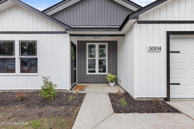 property entrance with a garage