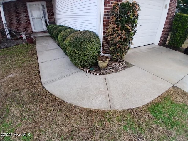 view of exterior entry with a garage