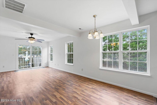 unfurnished room with beamed ceiling, ceiling fan with notable chandelier, and hardwood / wood-style flooring