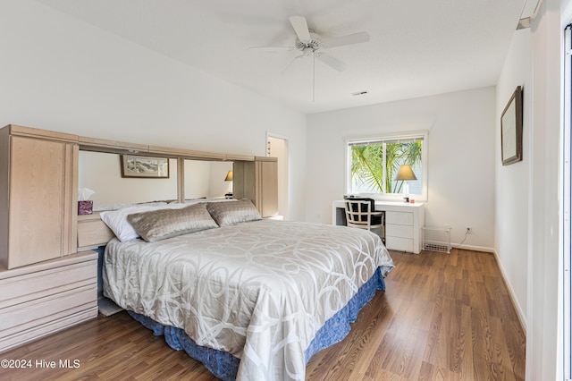 bedroom with ceiling fan and dark hardwood / wood-style flooring