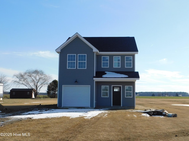 view of front of property featuring a garage