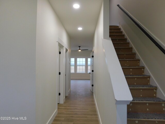 stairway with concrete flooring