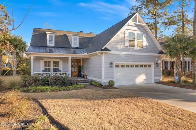 view of front of property featuring a garage and covered porch