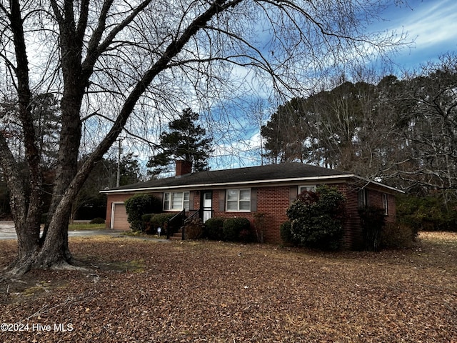 ranch-style house featuring a garage