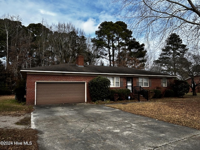 ranch-style home with a garage