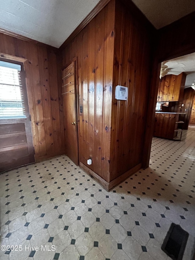 interior space featuring wooden walls