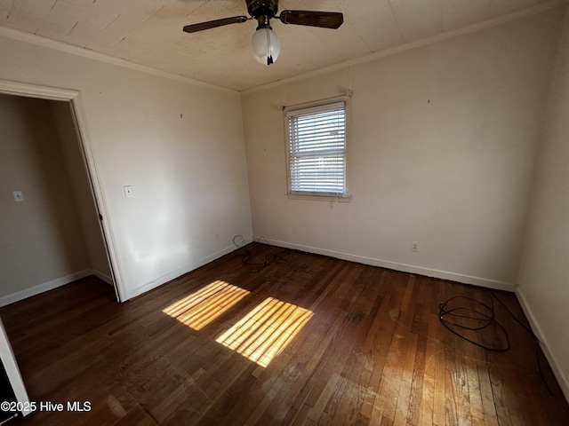 unfurnished room featuring ceiling fan, dark wood-type flooring, and ornamental molding