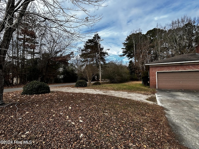 view of yard featuring a garage