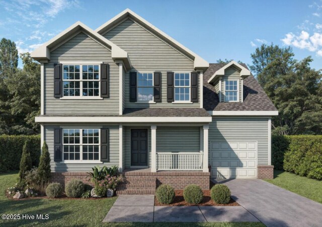 view of front facade with a front yard, a garage, and a porch