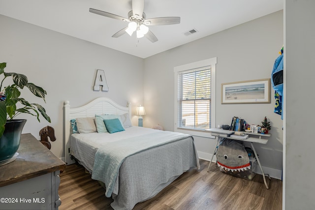 bedroom featuring ceiling fan and dark hardwood / wood-style flooring