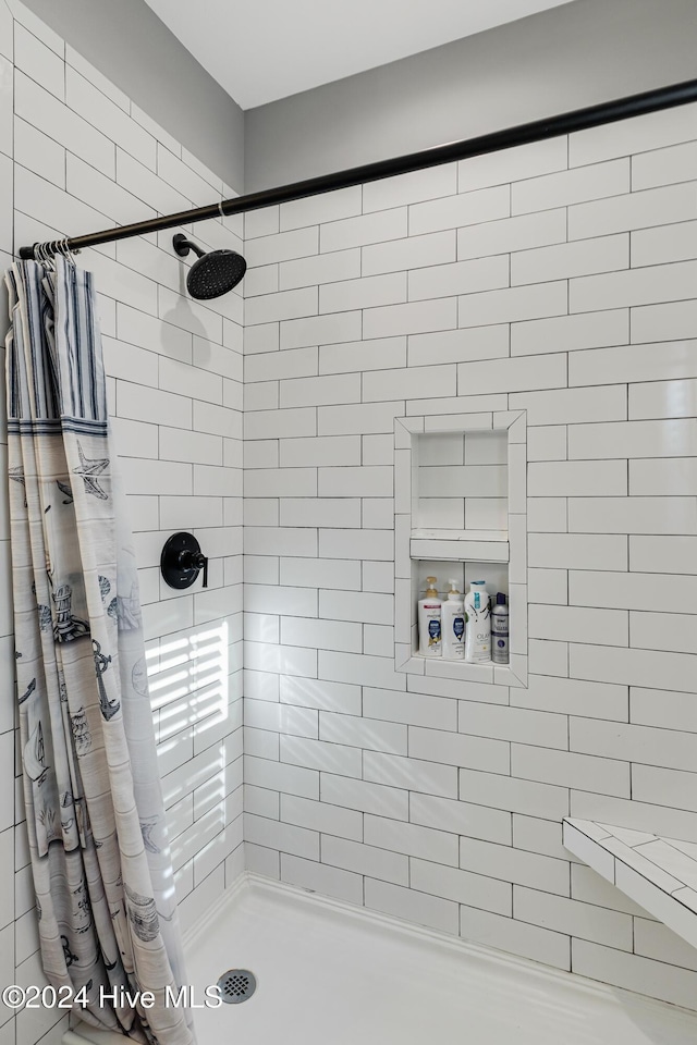 bathroom with a shower with shower curtain