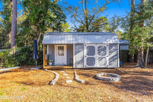 view of outdoor structure with an outdoor fire pit