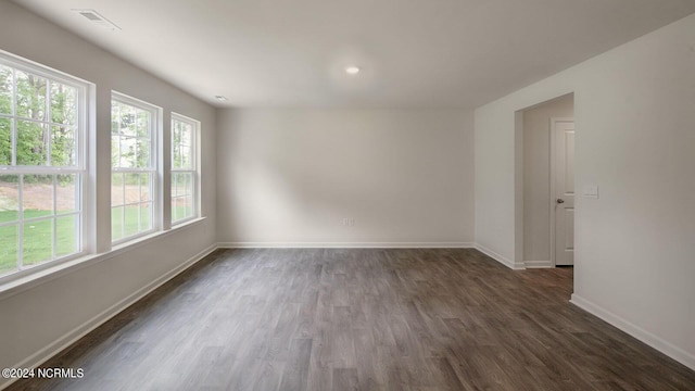 empty room with dark hardwood / wood-style floors