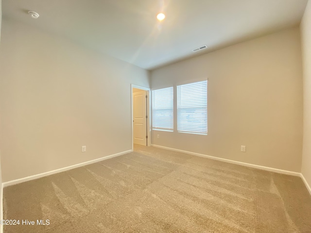 unfurnished room with carpet floors