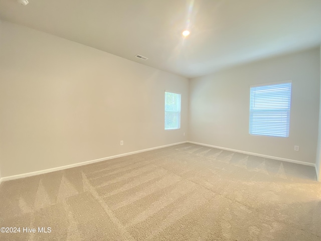 unfurnished room with carpet flooring