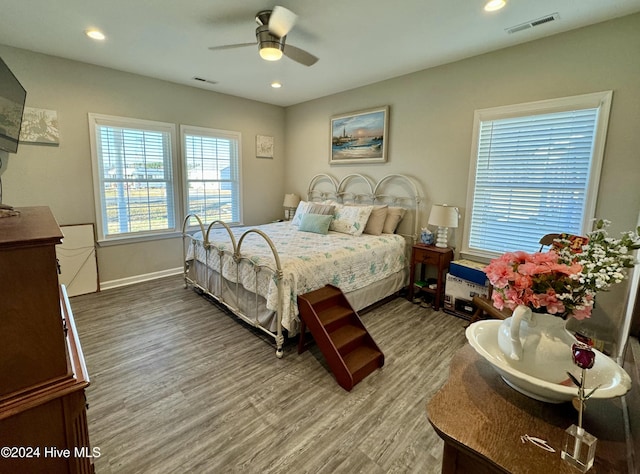 bedroom featuring ceiling fan and hardwood / wood-style flooring