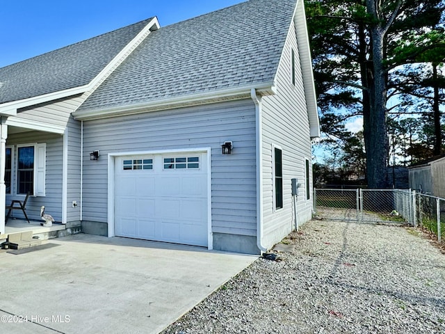 view of side of property featuring a garage