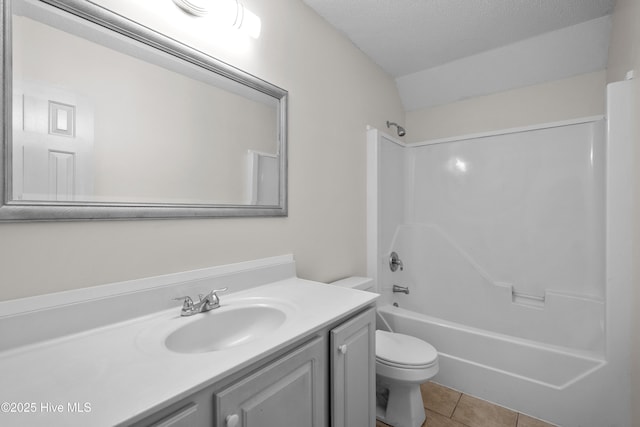 full bathroom with tile patterned floors, vanity, a textured ceiling, shower / tub combination, and toilet