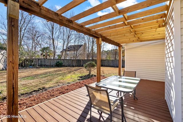 deck with a pergola and a yard