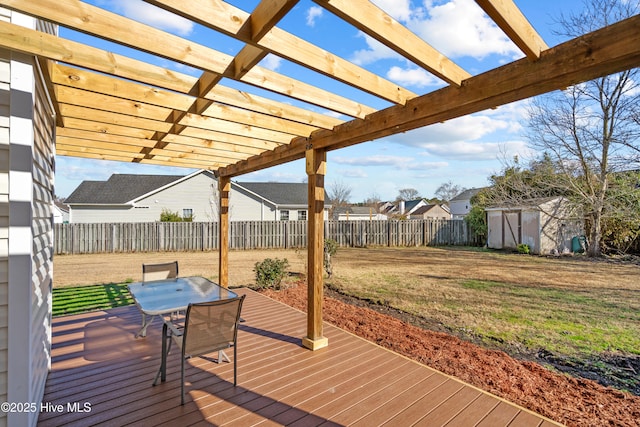 wooden terrace featuring a pergola and a shed