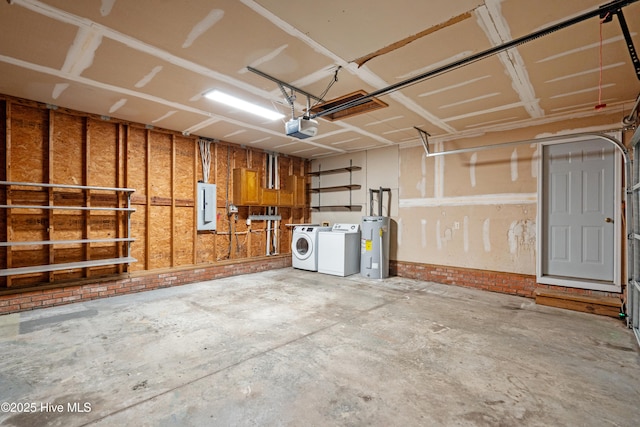 garage featuring washer and dryer, a garage door opener, electric panel, and water heater