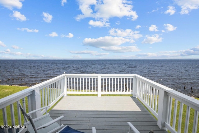 wooden deck with a water view