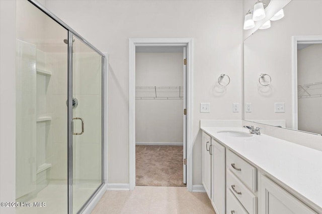 bathroom with vanity and an enclosed shower