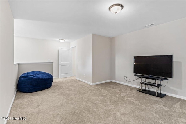 living area with light colored carpet