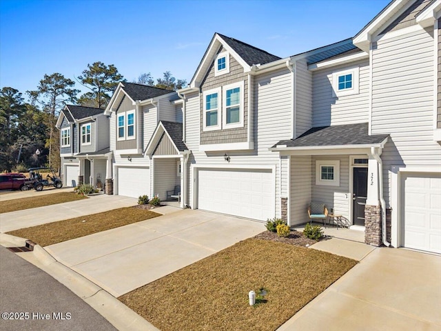 multi unit property featuring a garage