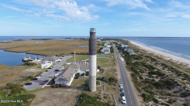 aerial view with a water view and a view of the beach