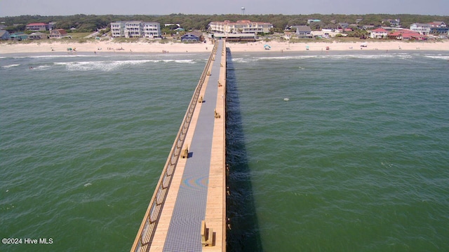 exterior space featuring a water view and a view of the beach