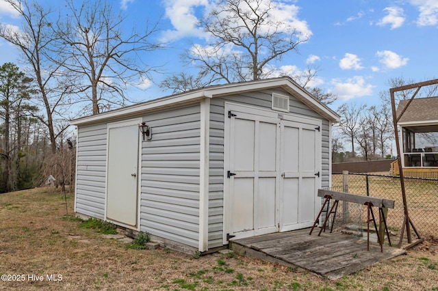 view of shed with fence