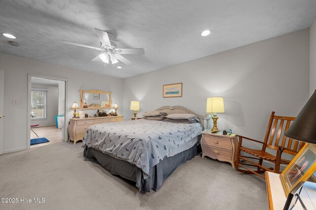 bedroom with a ceiling fan, a textured ceiling, recessed lighting, and light carpet