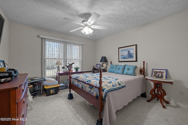 carpeted bedroom with a ceiling fan