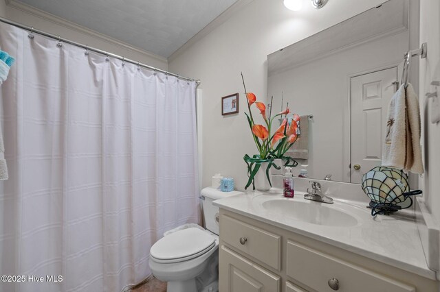 full bathroom with vanity, toilet, and ornamental molding