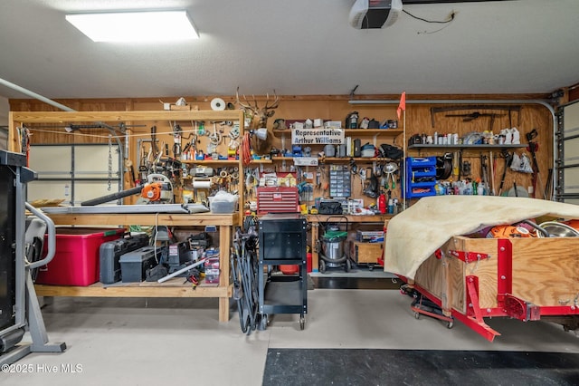 garage featuring a workshop area and a garage door opener