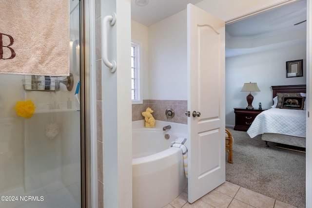 bathroom with tile patterned floors and separate shower and tub