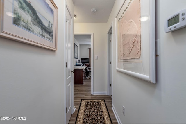 corridor featuring dark hardwood / wood-style flooring