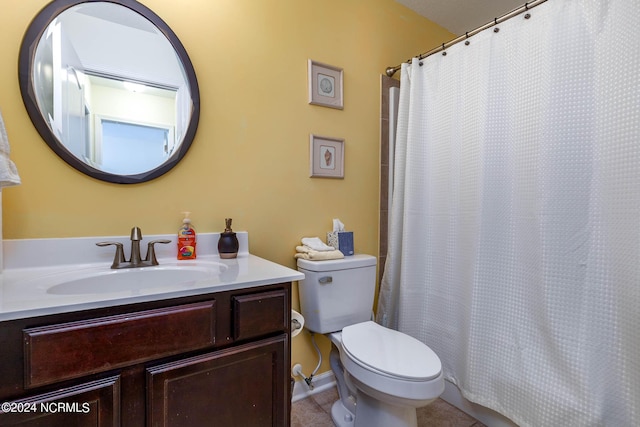 bathroom with tile patterned floors, vanity, a shower with shower curtain, and toilet