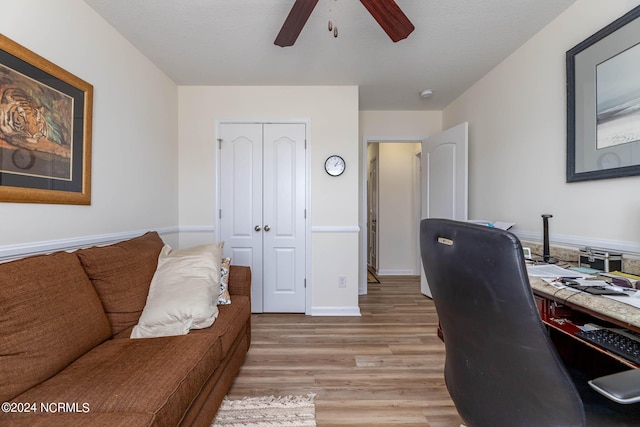 office with ceiling fan and light wood-type flooring