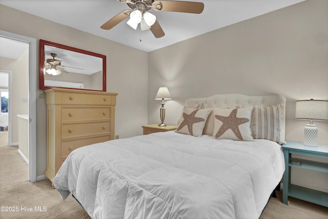 bedroom with light colored carpet and ceiling fan