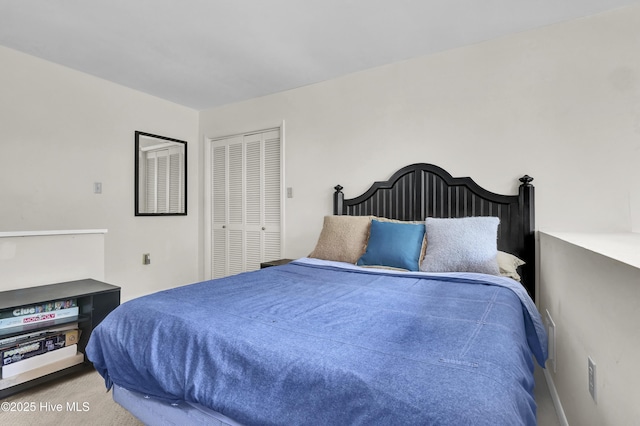 carpeted bedroom with a closet