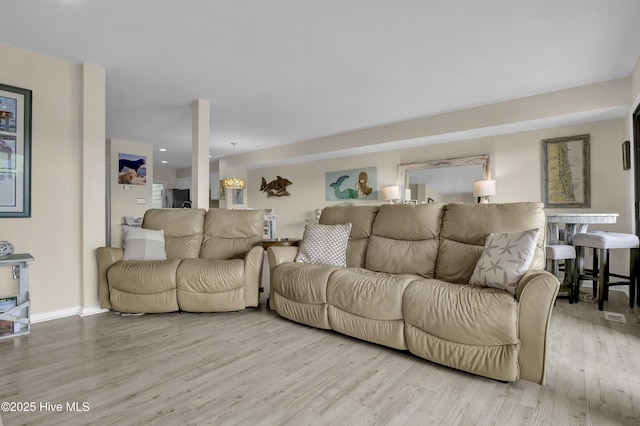 living room featuring baseboards and wood finished floors