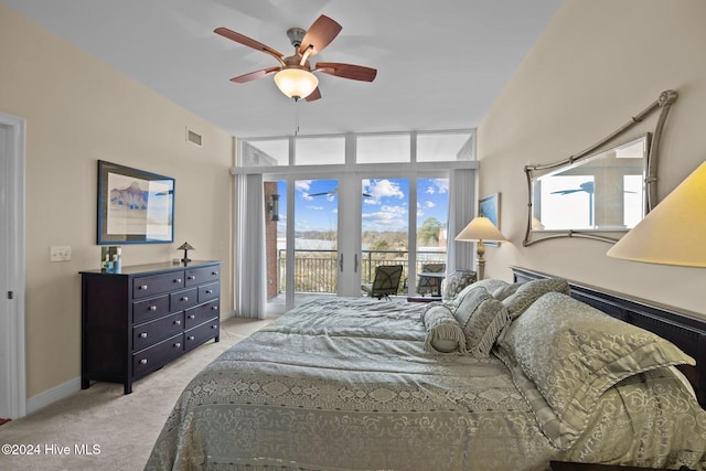 carpeted bedroom with access to exterior and ceiling fan