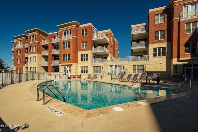 view of pool featuring a patio