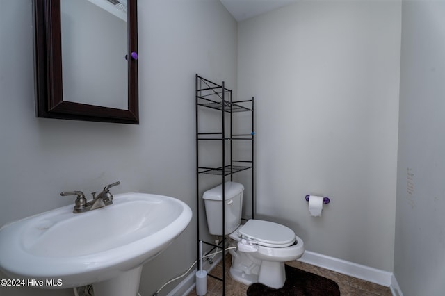 bathroom with toilet and sink