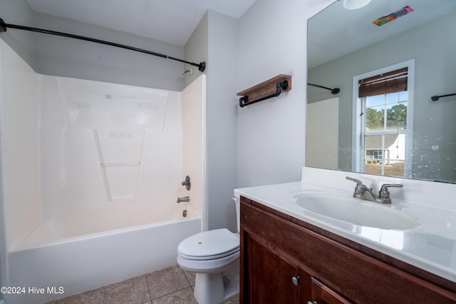 full bathroom with tile patterned floors, vanity,  shower combination, and toilet