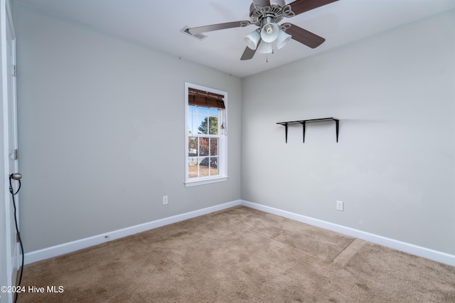 carpeted empty room with ceiling fan