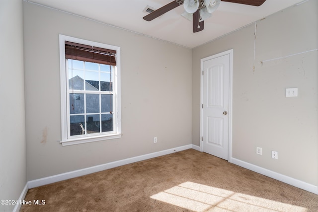 carpeted empty room with ceiling fan